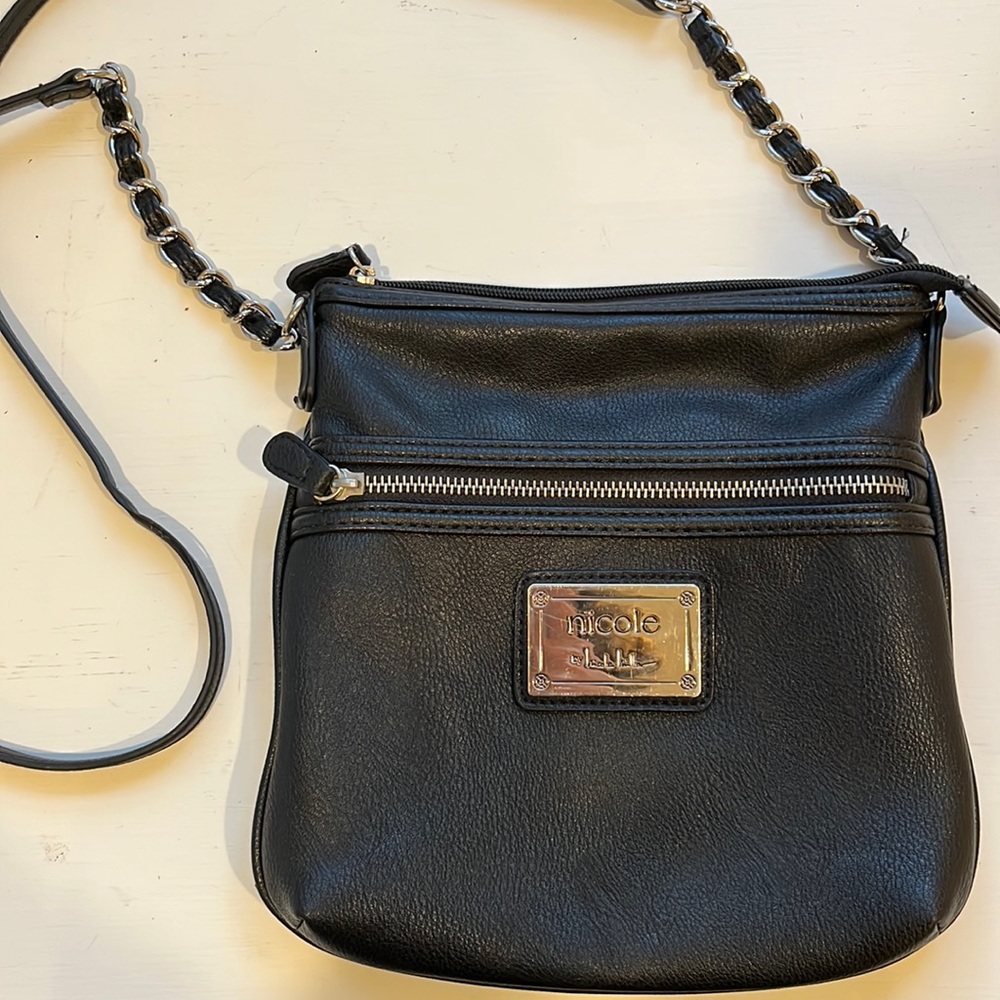 Cross body bag with zippered pouches and silver metal accents